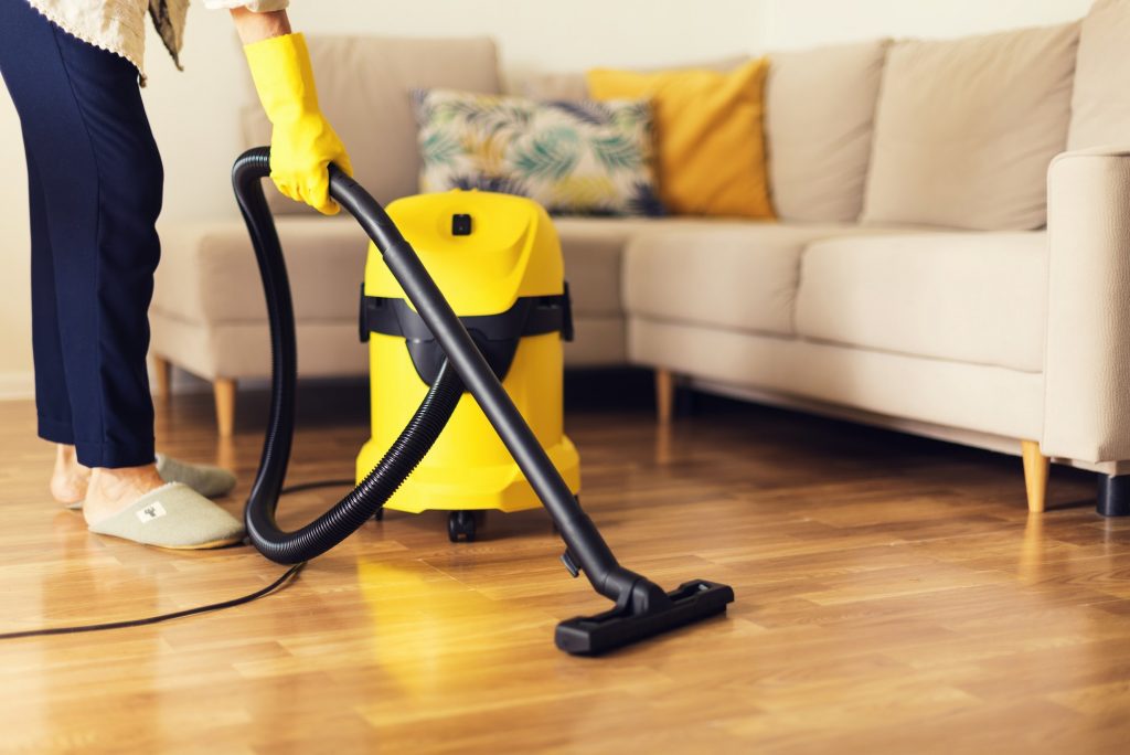 woman-cleaning-sofa-with-yellow-vacuum-cleaner-copy-space-cleaning-service-concept-1024x684